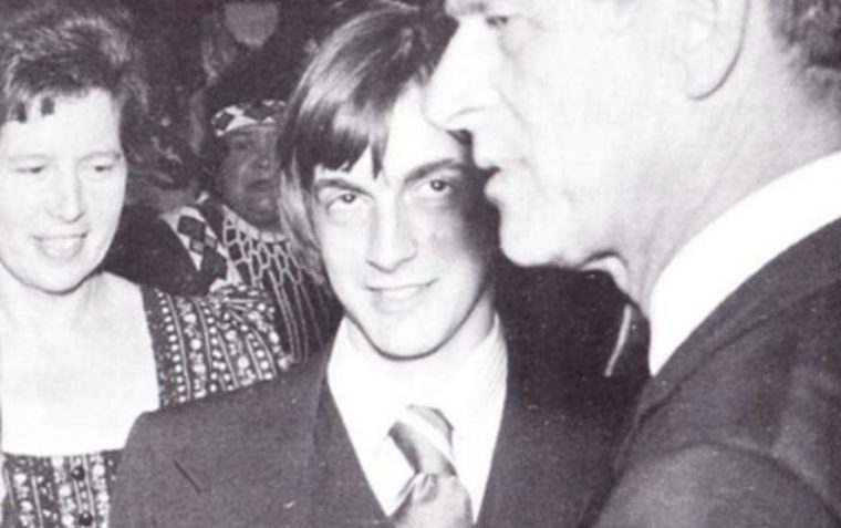 A close-up picture of James Raven and Prince Philip with two women in the background.