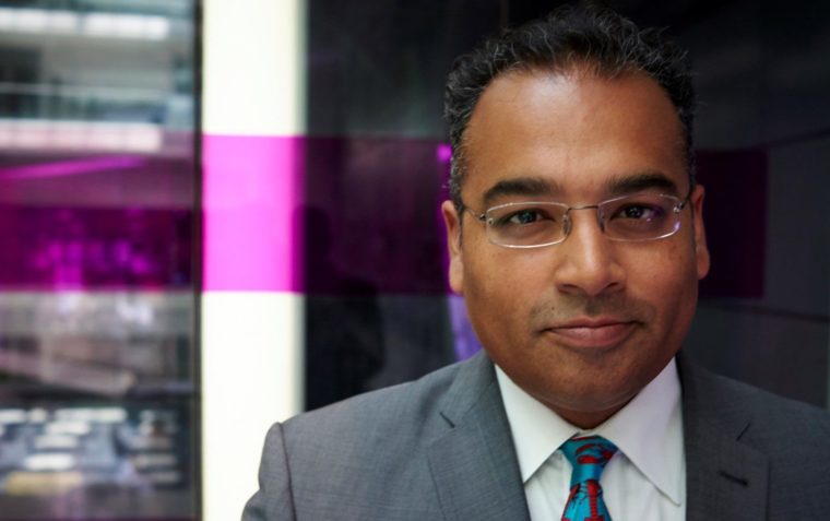 A close-up picture of Krishnan Guru-Murthy wearing contact lens glasses.