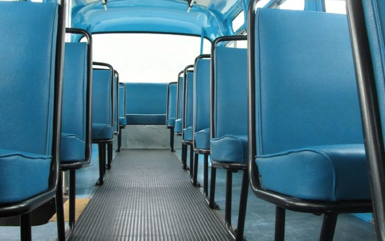 The blue leather seats of a US public bus