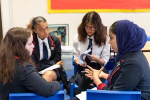 Students engaging in oracy in a classroom