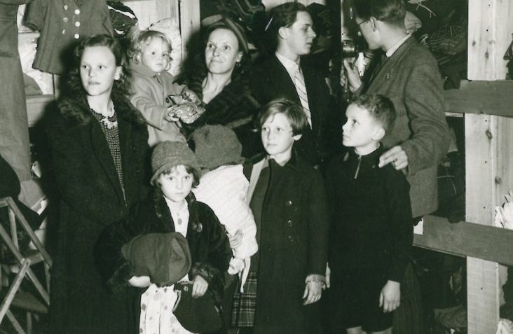 a family are pictured in workrooms having received donations from the ESU.