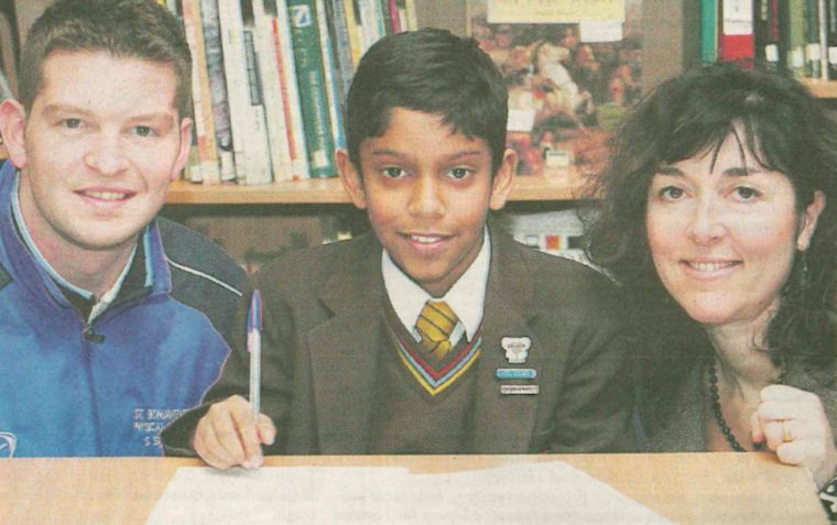 Tommy Seagull as a young boy at St Bonaventure's school with two teachers on either side