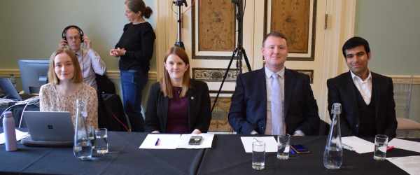 Volunteer judges for the ESU sat at a table